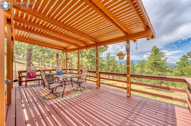 575 Wykagyl Rd, Westcliffe, CO 81252 - wooden terrace with outdoor dining area and a pergola