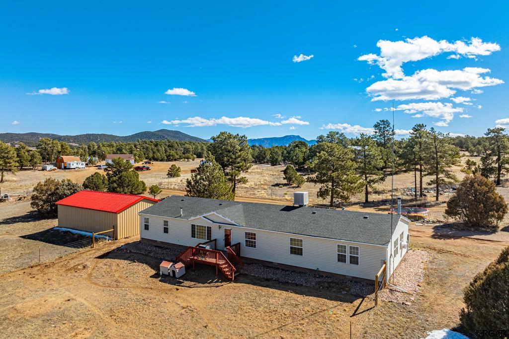 birds eye view of property featuring a mountain view