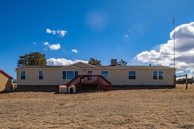 back of house with a wooden deck and central AC unit