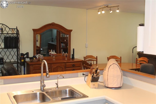 kitchen with light countertops and a sink