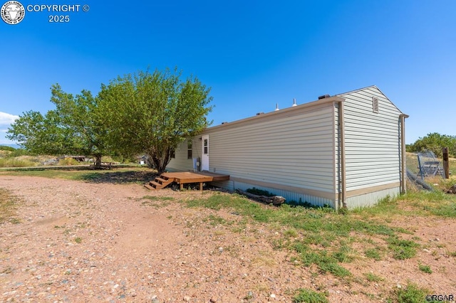 view of property exterior featuring a deck