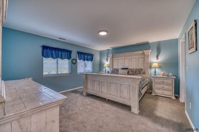 bedroom with light colored carpet