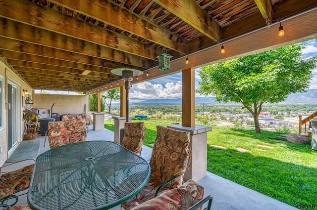 view of patio / terrace featuring a mountain view