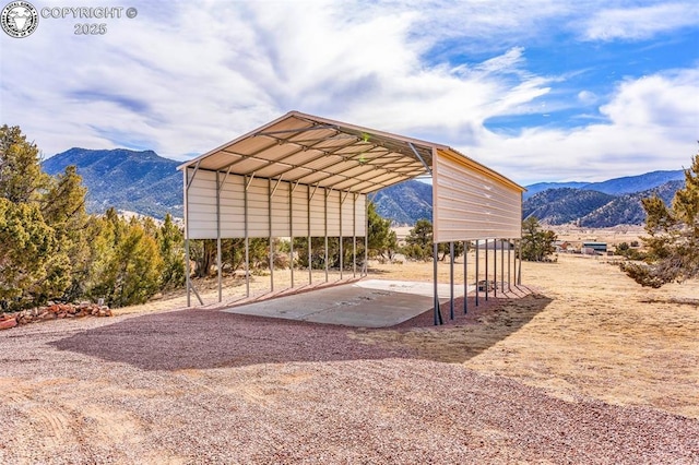 exterior space featuring a carport and a mountain view