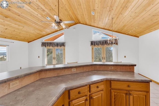 kitchen featuring vaulted ceiling, light tile patterned flooring, ceiling fan with notable chandelier, wood ceiling, and french doors