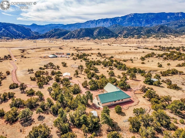 aerial view with a mountain view and a rural view