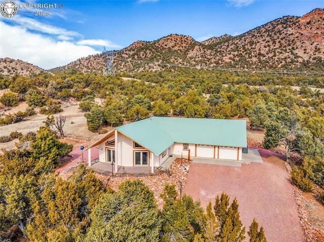 birds eye view of property with a mountain view