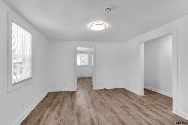 unfurnished room featuring light wood-type flooring