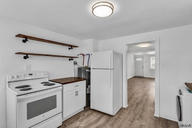 kitchen with white cabinetry, washer / dryer, white appliances, and light hardwood / wood-style floors