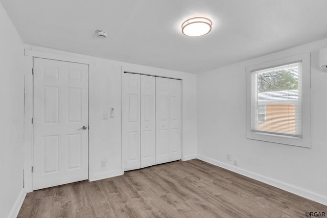 unfurnished bedroom featuring light wood-type flooring