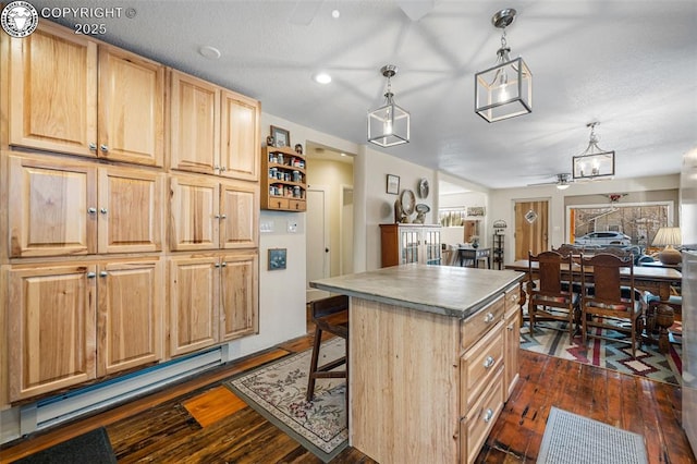 kitchen with a kitchen island, open floor plan, dark wood finished floors, and light brown cabinetry