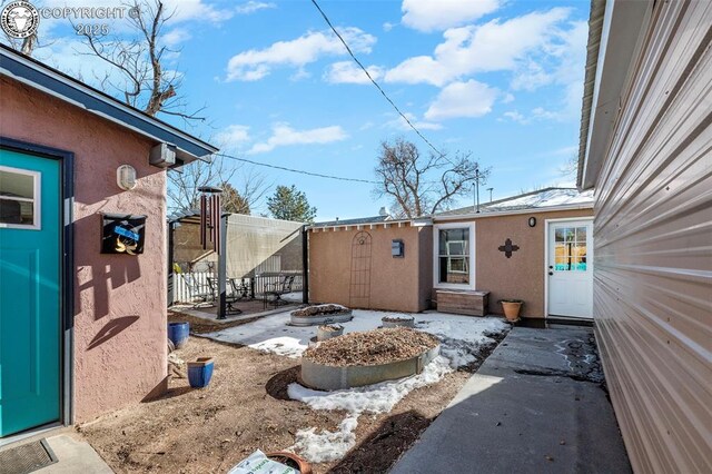 view of yard with an outdoor fire pit and fence