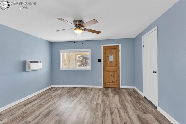 spare room with ceiling fan and light hardwood / wood-style flooring