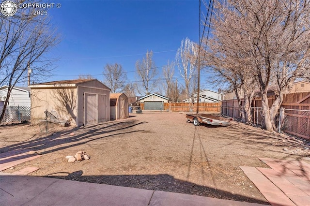 view of yard with a storage shed