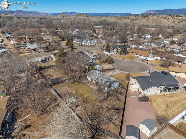 birds eye view of property with a residential view and a mountain view