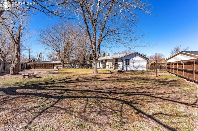 view of yard featuring a fenced backyard