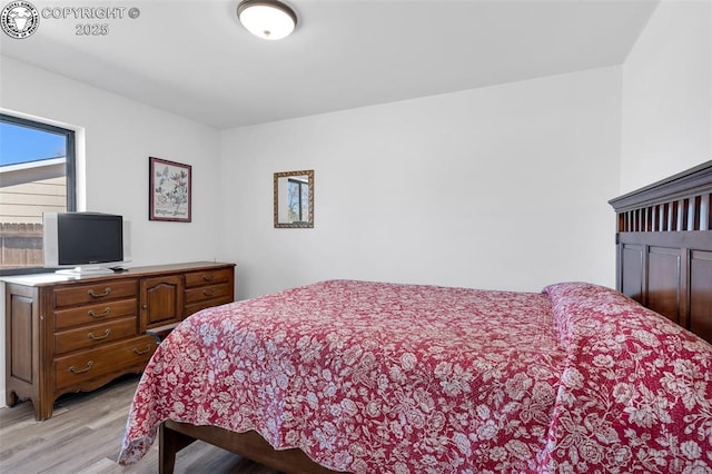 bedroom featuring light wood-style flooring