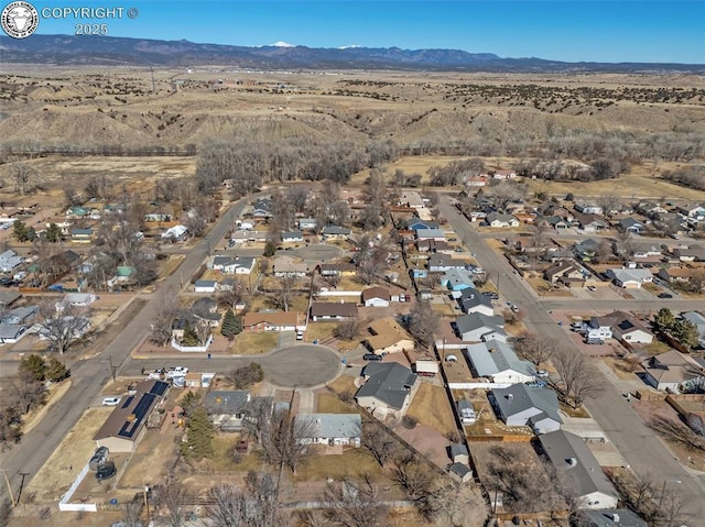 birds eye view of property with a residential view and a mountain view