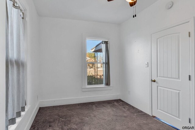 carpeted empty room with ceiling fan