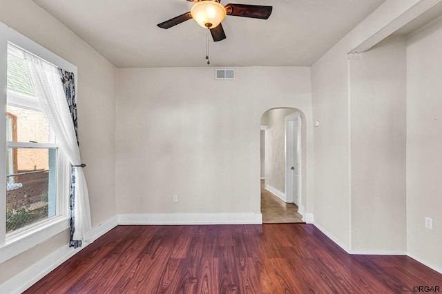 unfurnished room featuring dark hardwood / wood-style flooring and ceiling fan