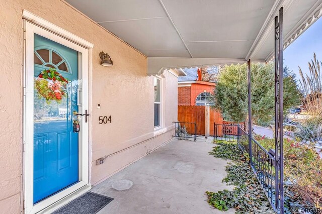 entrance to property with covered porch