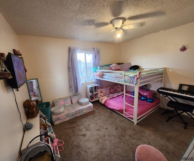 carpeted bedroom featuring ceiling fan and a textured ceiling