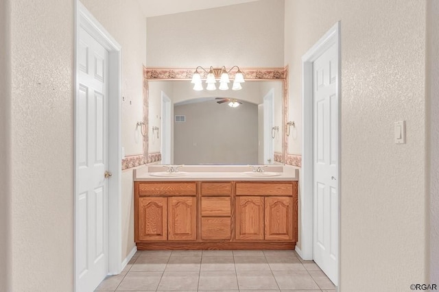 bathroom featuring tile patterned flooring and vanity