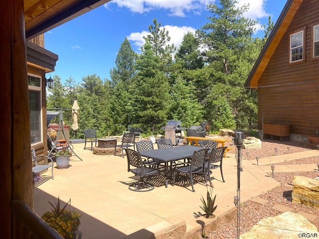 view of patio / terrace with a fire pit