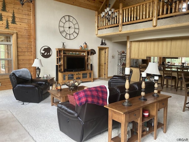 living room with light carpet, wood ceiling, wooden walls, and high vaulted ceiling