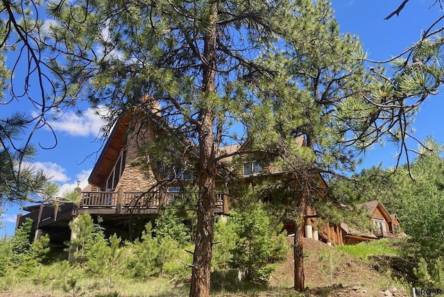 view of property exterior featuring a deck