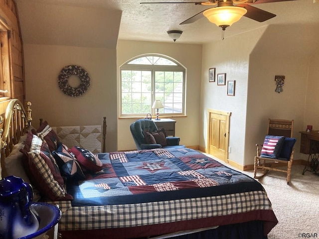 bedroom featuring carpet, a textured ceiling, and ceiling fan