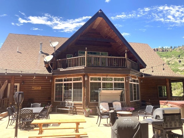 back of house with a patio and a balcony