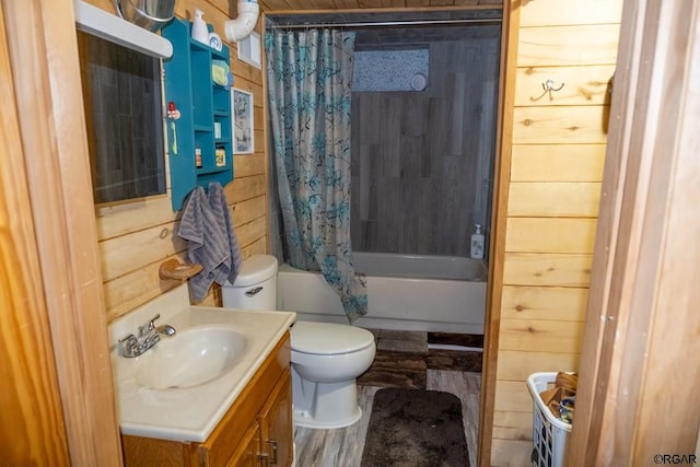 full bathroom with shower / tub combo with curtain, toilet, wood walls, vanity, and hardwood / wood-style floors