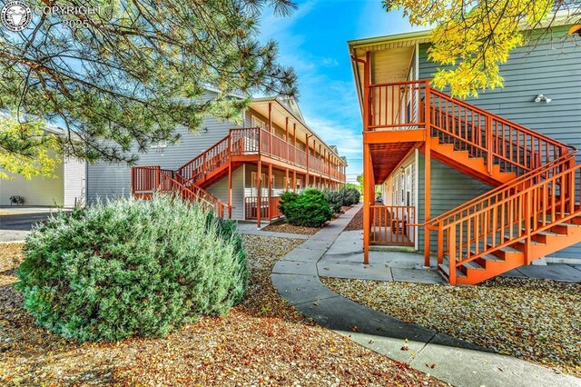 property entrance with a wooden deck