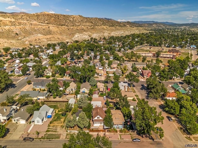 drone / aerial view with a residential view and a mountain view