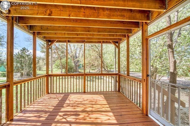 unfurnished sunroom featuring a healthy amount of sunlight