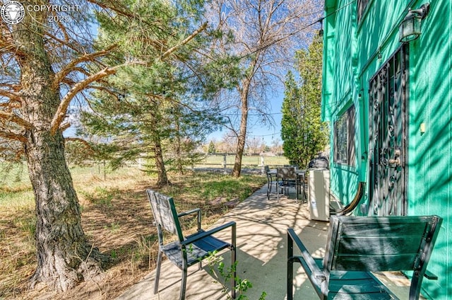 view of patio / terrace featuring outdoor dining space and fence