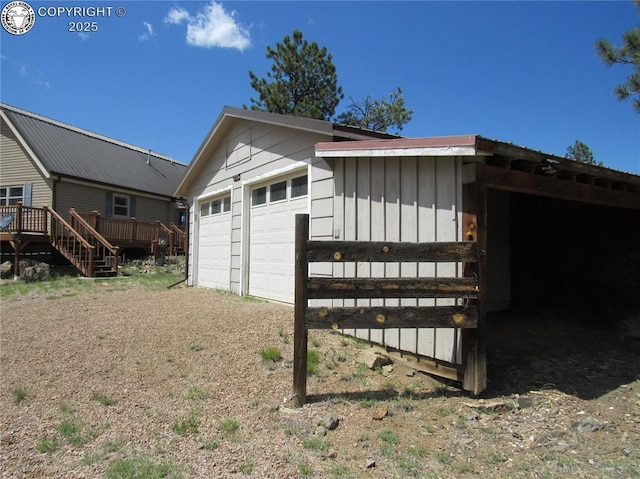 855 Ernest Ave, Westcliffe, CO 81252 - view of side of property with board and batten siding, a garage, an outbuilding, and a deck