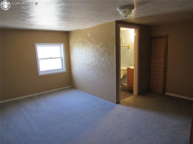 855 Ernest Ave, Westcliffe, CO 81252 - unfurnished bedroom featuring carpet floors and connected bathroom