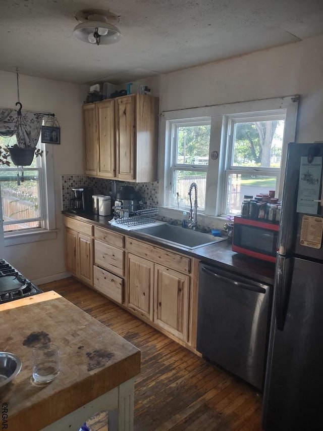 kitchen with sink, fridge, dark hardwood / wood-style flooring, dishwasher, and backsplash