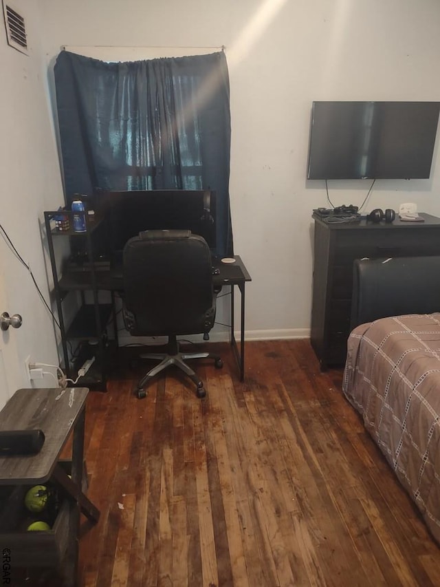 bedroom featuring dark wood-type flooring