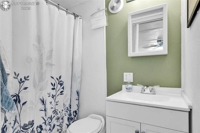 bathroom with visible vents, toilet, vanity, and a shower with curtain