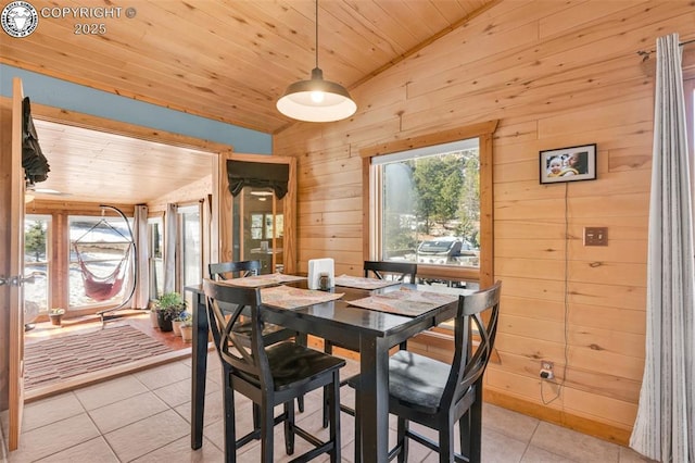 dining room featuring light tile patterned flooring, plenty of natural light, wooden ceiling, and vaulted ceiling