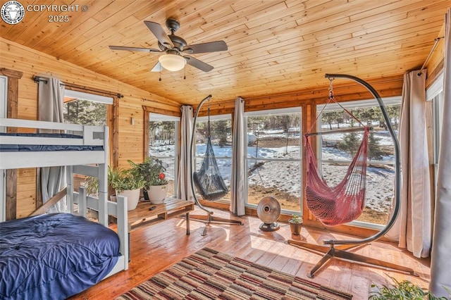 sunroom / solarium with plenty of natural light, lofted ceiling, and wooden ceiling