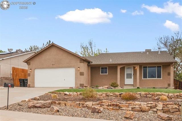 ranch-style house with roof with shingles, fence, concrete driveway, an attached garage, and stucco siding