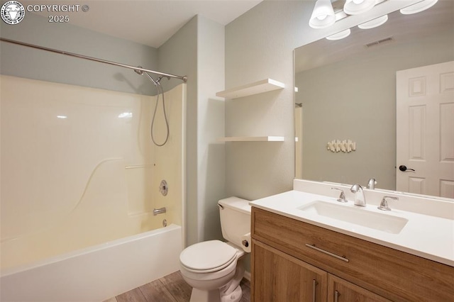 full bath featuring vanity, toilet, shower / bath combination, wood finished floors, and visible vents