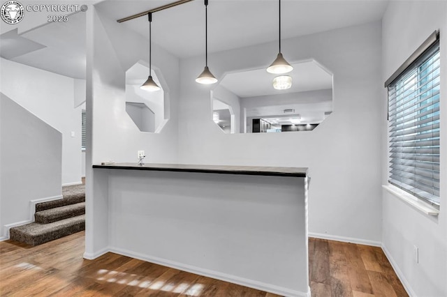 855 5th St, Penrose, CO 81240 - bar area with wood finished floors, baseboards, and pendant lighting