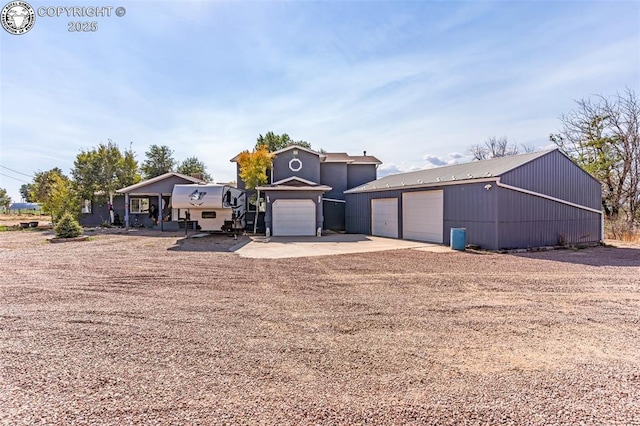 855 5th St, Penrose, CO 81240 - view of front of home with driveway and an outdoor structure