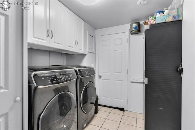 855 5th St, Penrose, CO 81240 - laundry room featuring cabinet space, washing machine and dryer, and light tile patterned floors