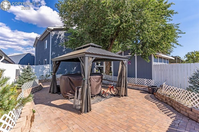855 5th St, Penrose, CO 81240 - view of patio / terrace with a gazebo, a fenced backyard, a hot tub, and a grill